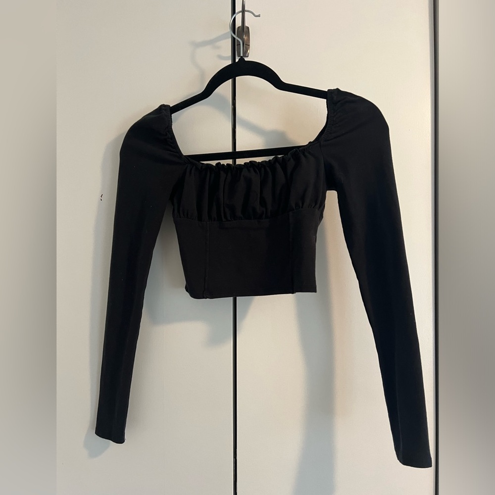 Black stretchy, cropped top with ruffle